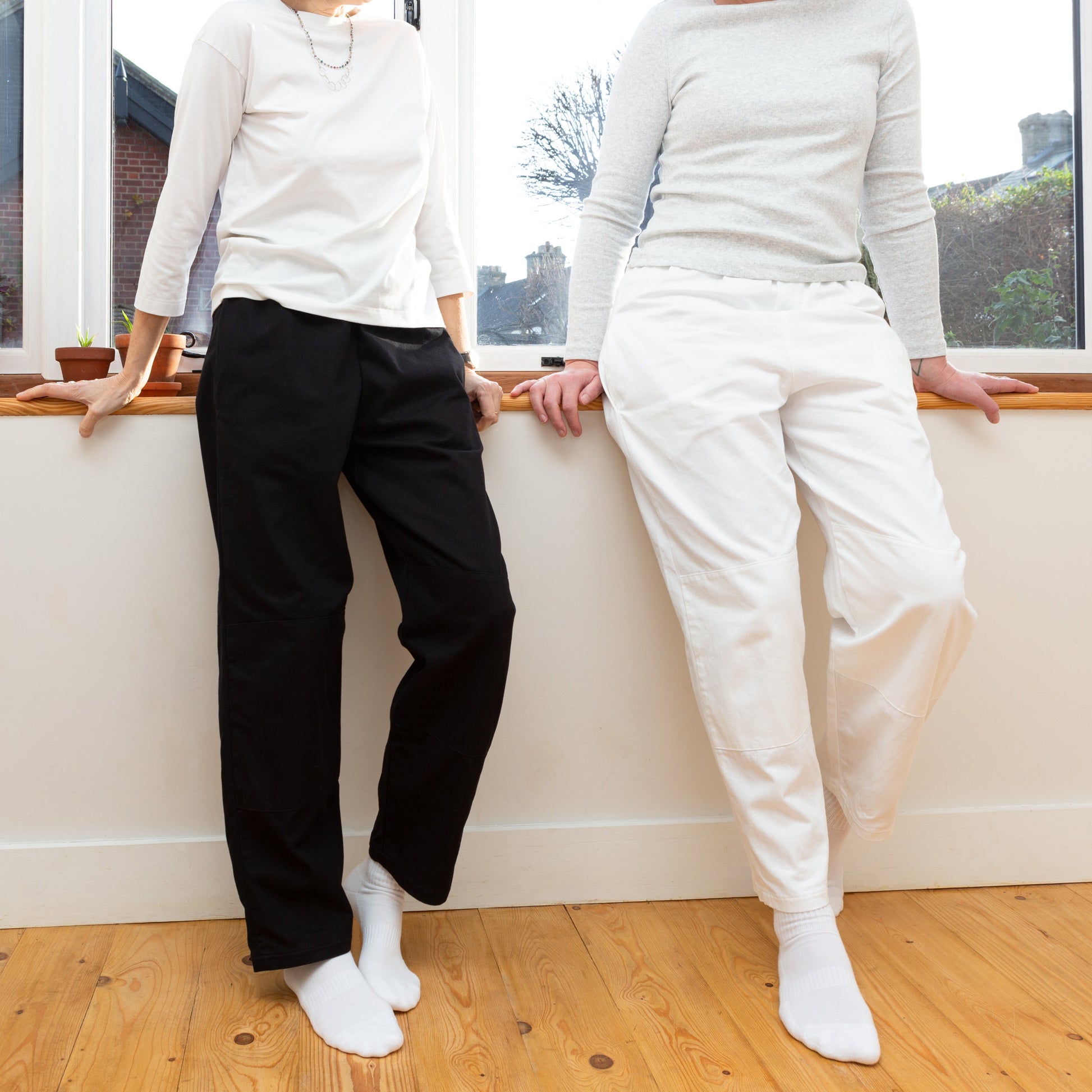 Maya is wearing Small, Kate is wearing Medium