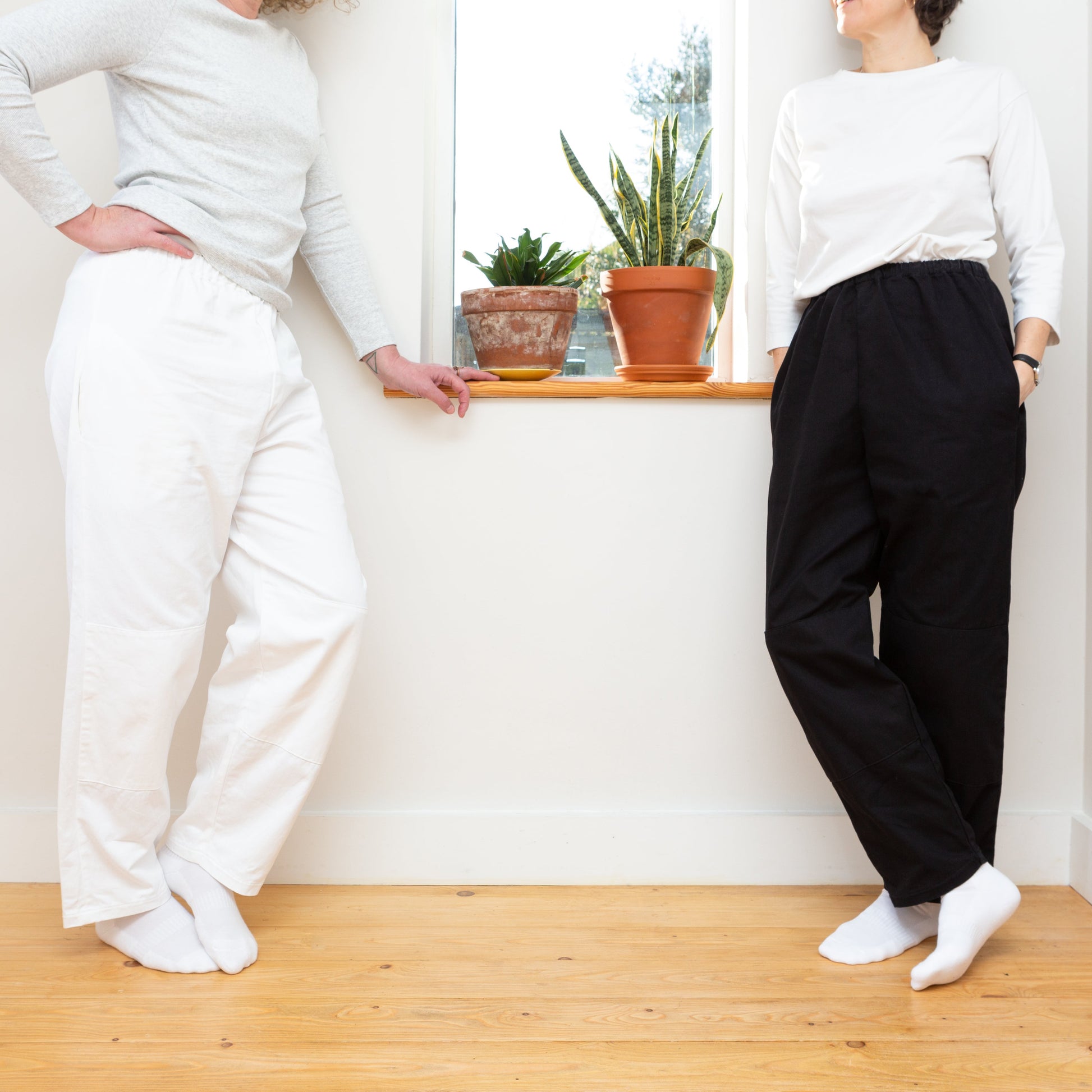 Kate is wearing Medium, Maya is wearing Small